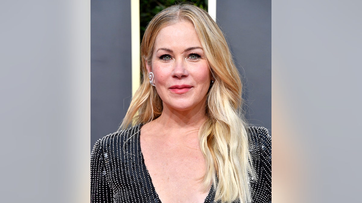 Christina Applegate wore a flowing black dress with a soft smile on the carpet